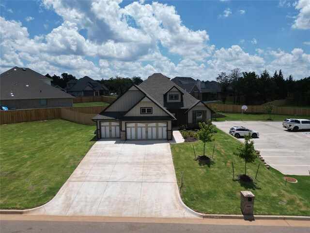 8800 Tyrion Dr, Edmond, OK 73007 - view of front of home with driveway, a residential view, and an attached garage