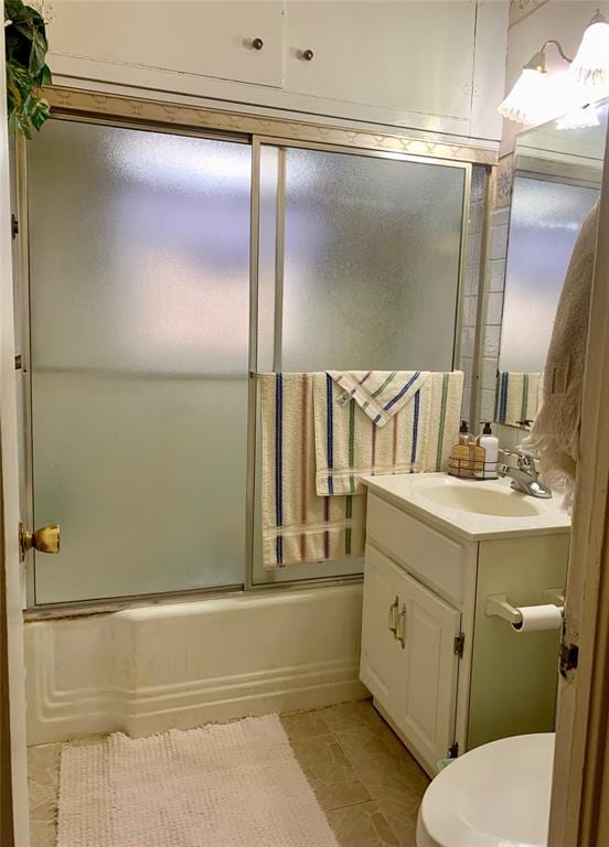 full bathroom featuring vanity, toilet, and enclosed tub / shower combo