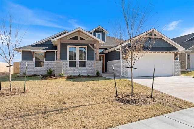 craftsman-style home featuring a garage and a front lawn