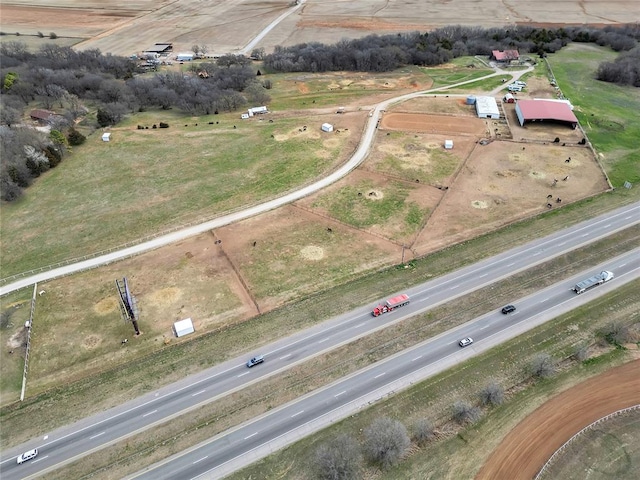 birds eye view of property featuring a rural view