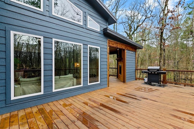 wooden terrace featuring grilling area