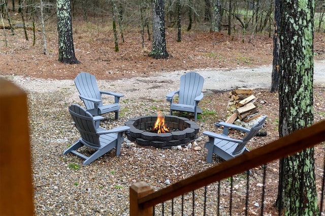 view of yard with an outdoor fire pit