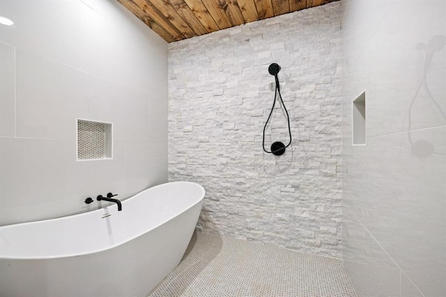 bathroom featuring a bathing tub and wood ceiling