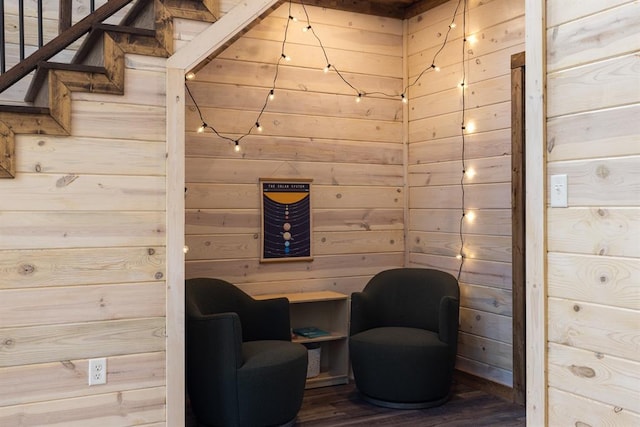 unfurnished room featuring wood walls and hardwood / wood-style flooring