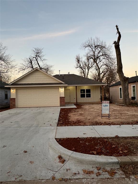 ranch-style home with a garage