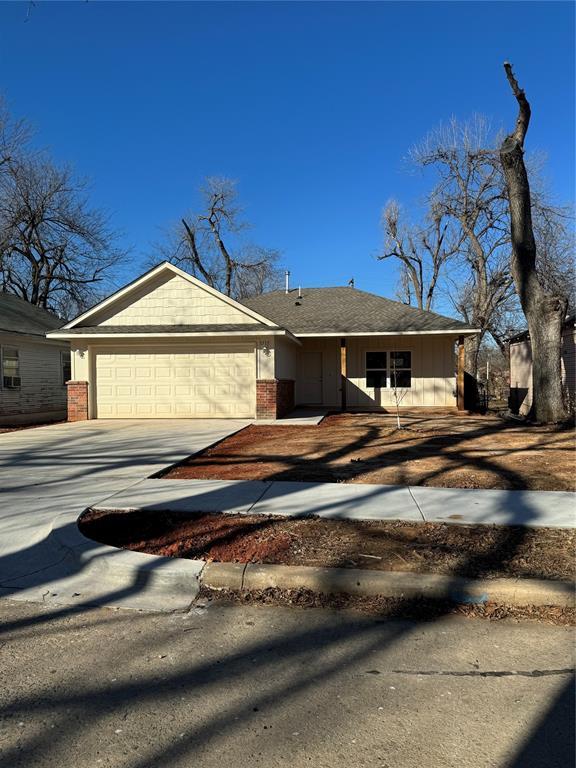 ranch-style home featuring a garage