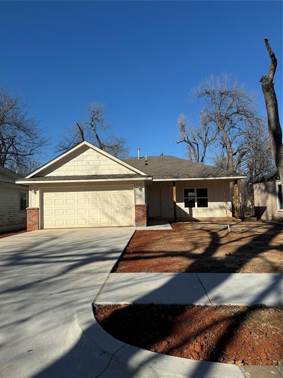 ranch-style home with a garage