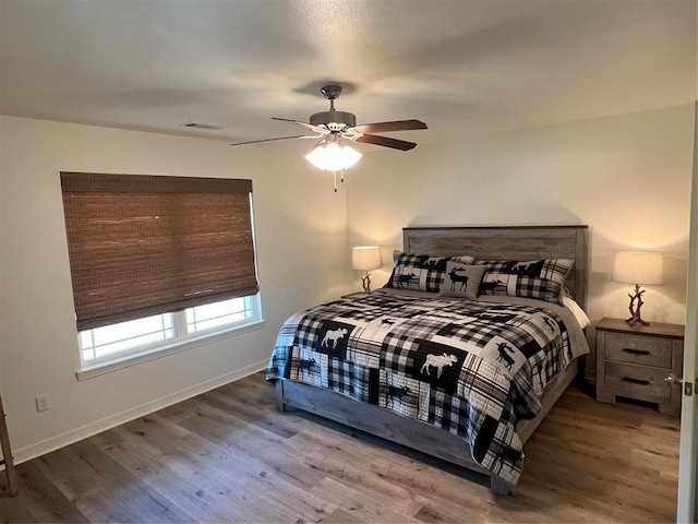 bedroom featuring ceiling fan and wood-type flooring