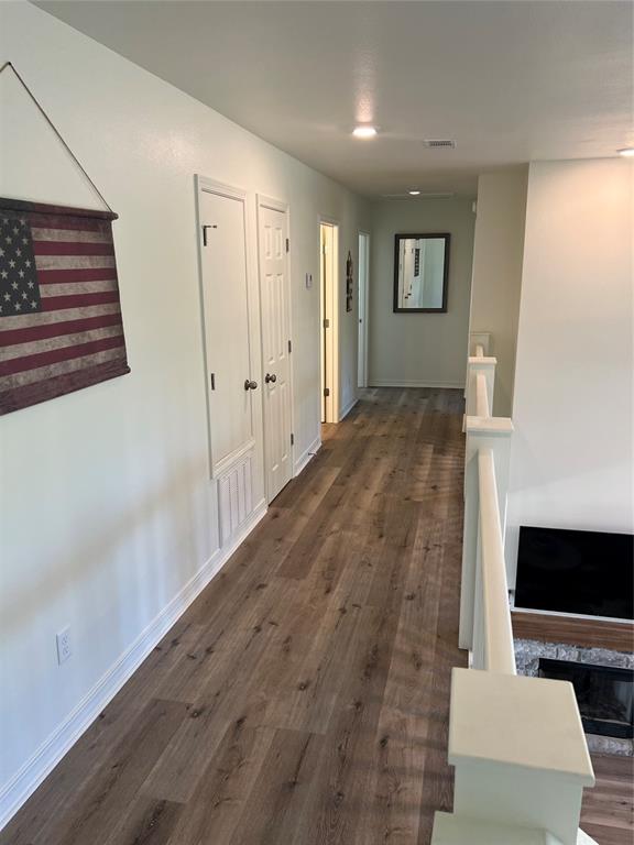 hallway featuring dark wood-type flooring