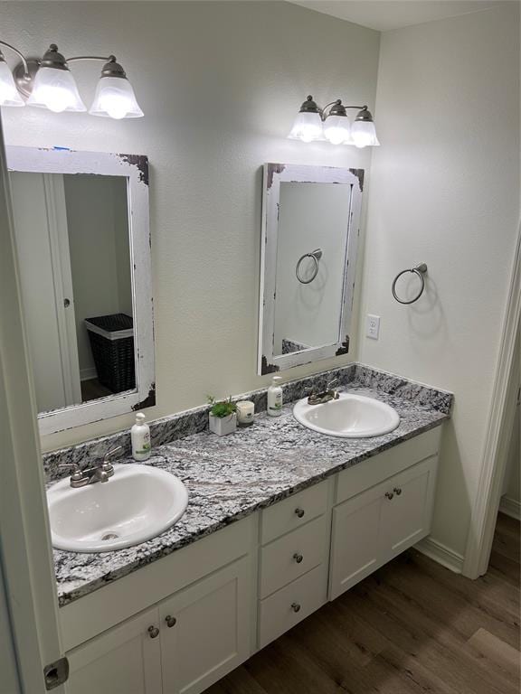 bathroom featuring hardwood / wood-style floors and vanity