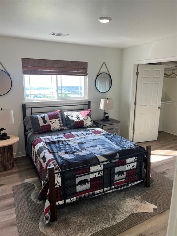 bedroom with hardwood / wood-style floors