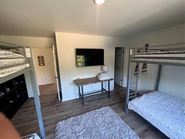 bedroom featuring dark hardwood / wood-style flooring