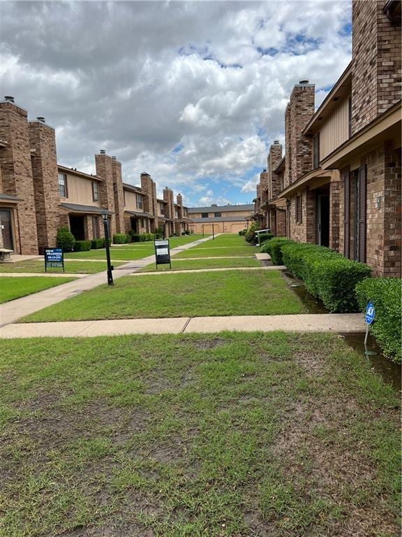 view of home's community featuring a yard