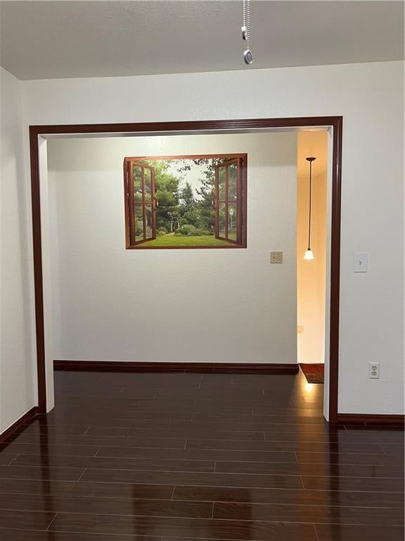 hallway featuring dark hardwood / wood-style floors