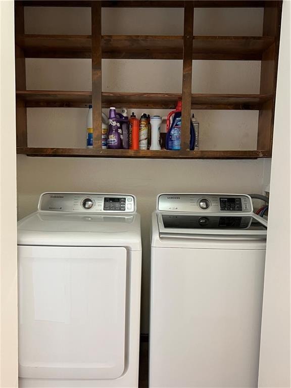 laundry area featuring washing machine and clothes dryer