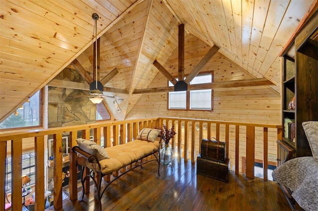 living area featuring wooden walls, hardwood / wood-style floors, high vaulted ceiling, and wooden ceiling