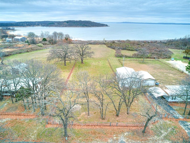 birds eye view of property featuring a rural view and a water view