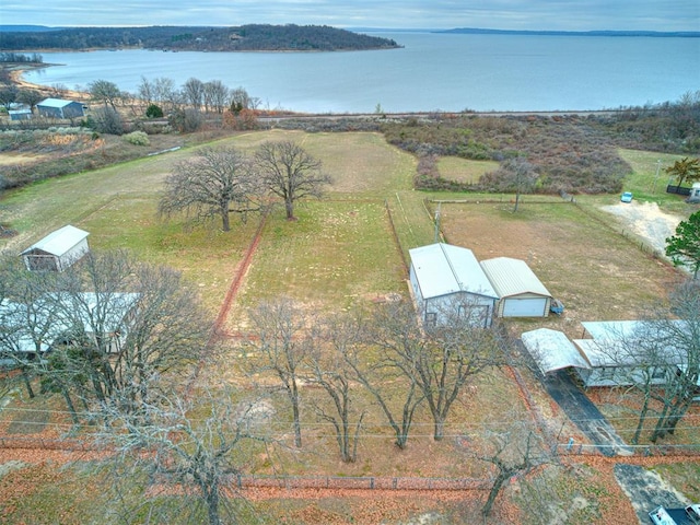 birds eye view of property featuring a rural view and a water view