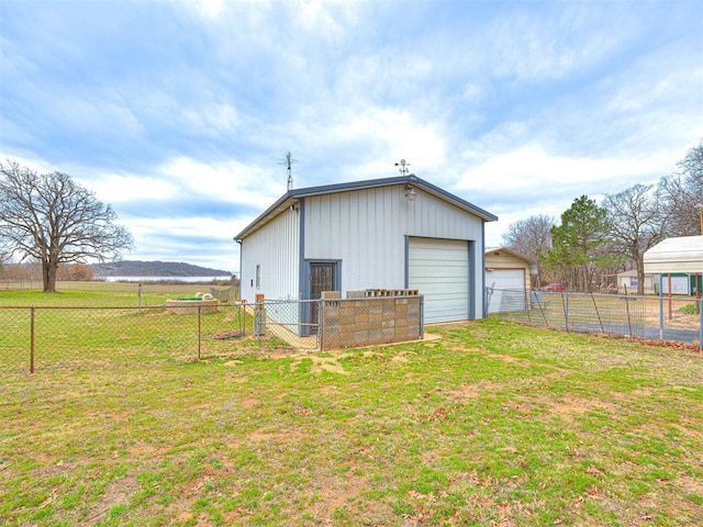 view of outbuilding featuring a yard and a garage