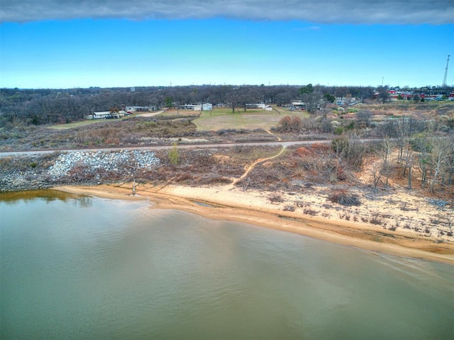 aerial view featuring a water view and a view of the beach