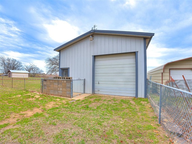 garage with a lawn