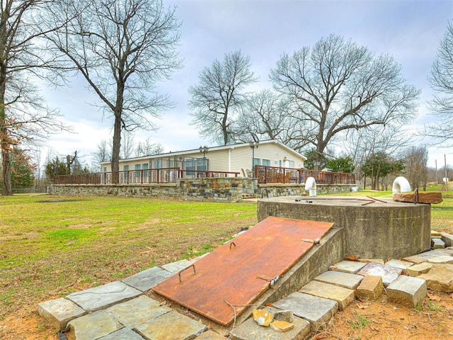 view of yard featuring a wooden deck