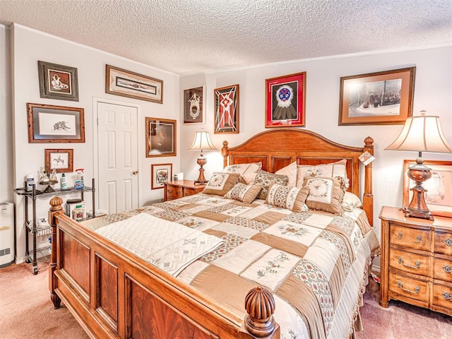 bedroom with carpet floors and a textured ceiling