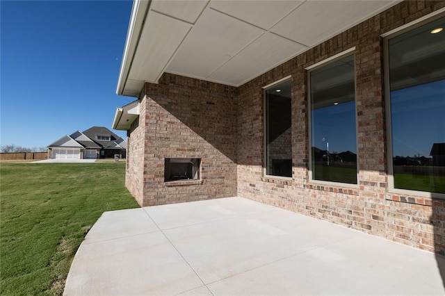 view of patio / terrace with an outdoor brick fireplace