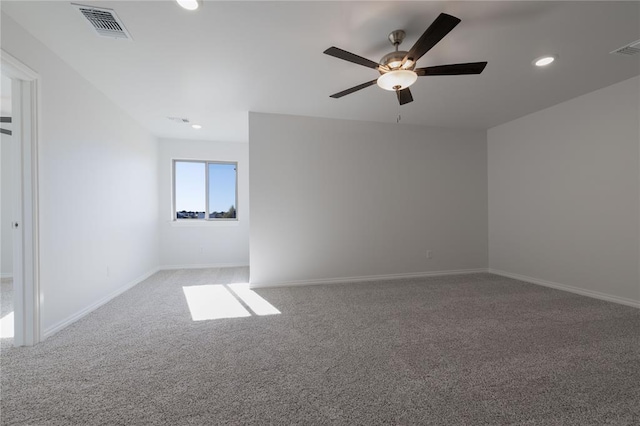 carpeted empty room with ceiling fan