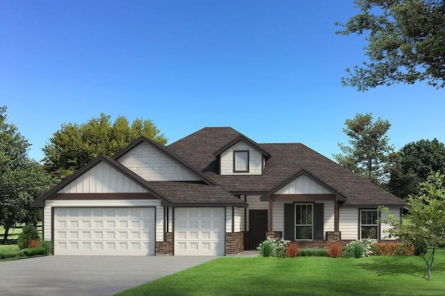 view of front of home featuring a front yard and a garage