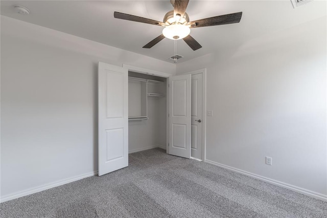 unfurnished bedroom featuring ceiling fan, carpet floors, and a closet