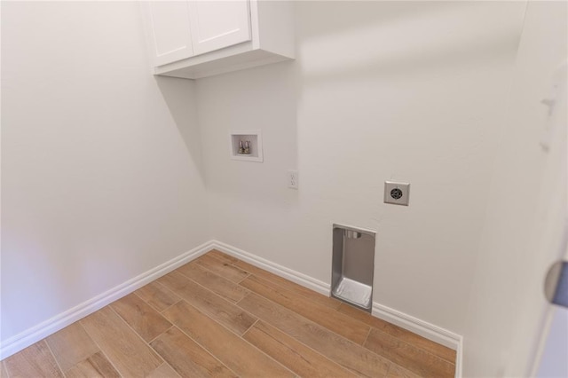 washroom featuring cabinets, hookup for a washing machine, and electric dryer hookup