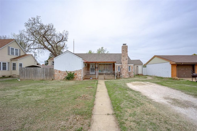 view of front of house featuring a front lawn and covered porch