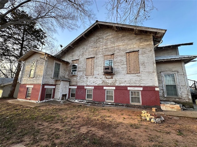 rear view of house with cooling unit