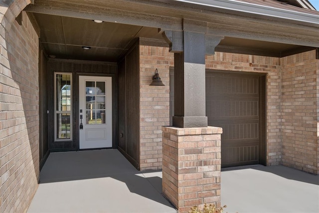 doorway to property featuring a garage