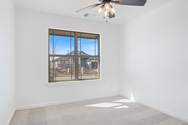 unfurnished room with ceiling fan and light colored carpet