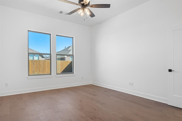 spare room featuring hardwood / wood-style flooring and ceiling fan