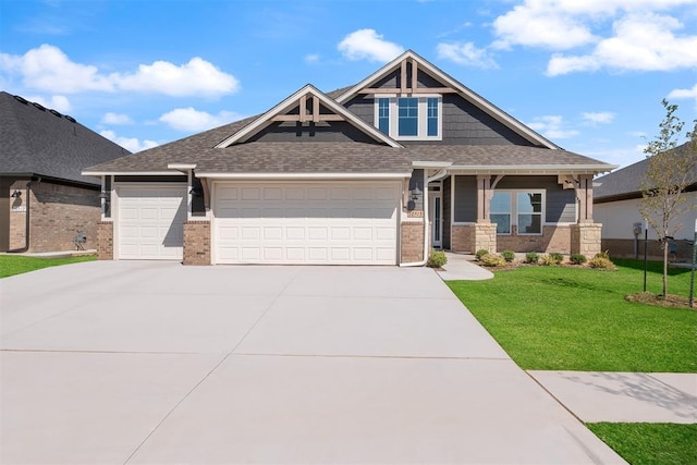 craftsman-style house with a front lawn and a garage