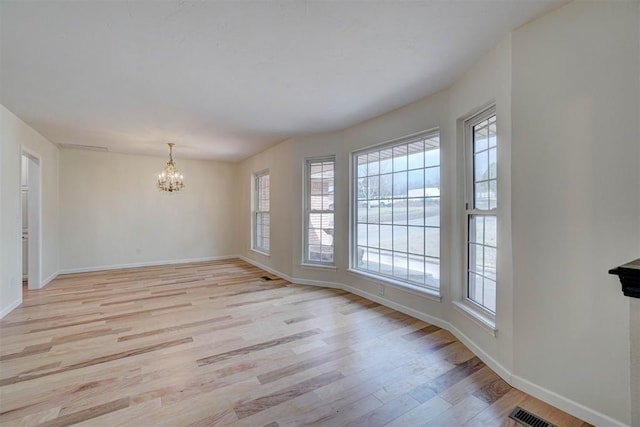 interior space with light hardwood / wood-style flooring and a chandelier