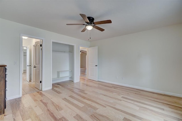 unfurnished bedroom featuring ceiling fan and light wood-type flooring