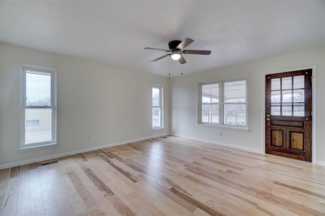 entrance foyer with ceiling fan and light wood-type flooring