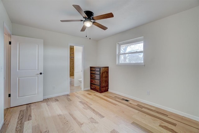 unfurnished bedroom with connected bathroom, ceiling fan, and light hardwood / wood-style flooring