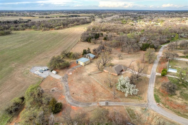 birds eye view of property with a rural view