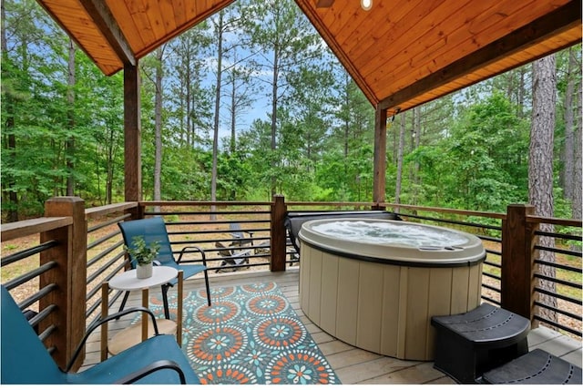 wooden terrace with a hot tub