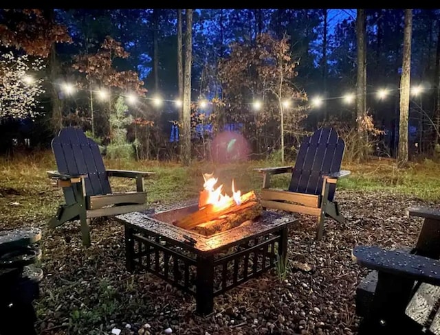 patio at night with an outdoor fire pit