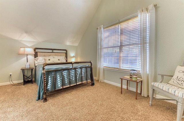 carpeted bedroom featuring vaulted ceiling