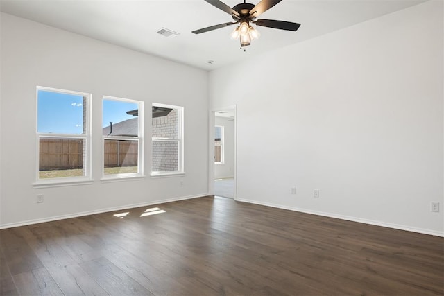 unfurnished room featuring dark hardwood / wood-style flooring and ceiling fan