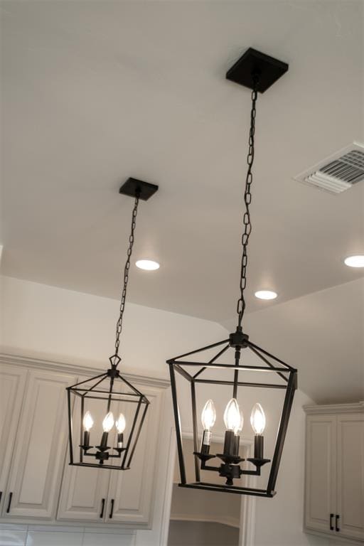 details with an inviting chandelier