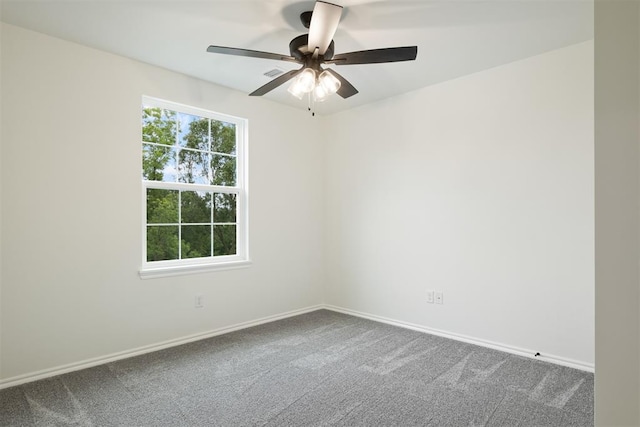 carpeted empty room featuring ceiling fan