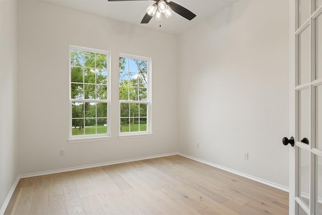 unfurnished room featuring light wood-type flooring and ceiling fan